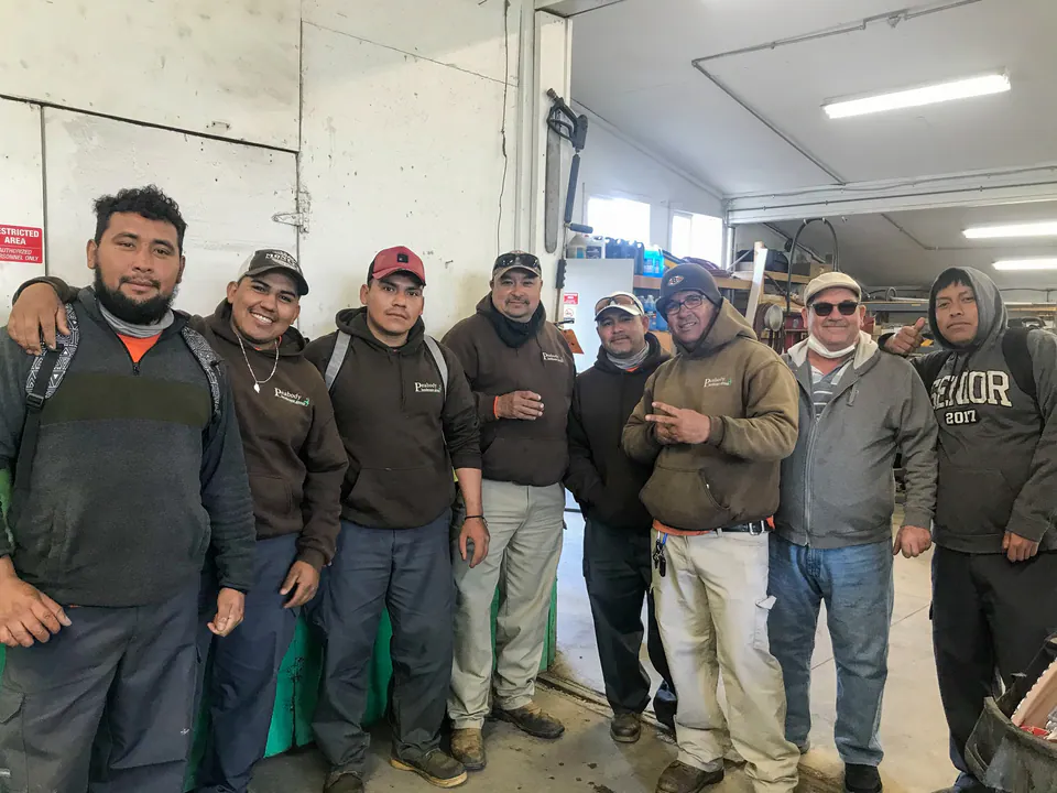 Peabody crew members gathered inside the shop